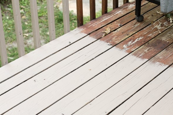 A deck partially stained with Behr taupe paint.