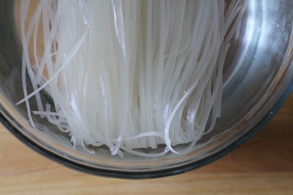 rice noodles soaking for pad thai