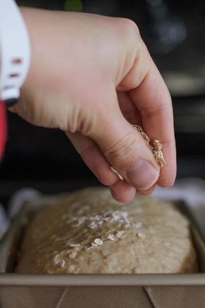 sprinkle oats on top of bread