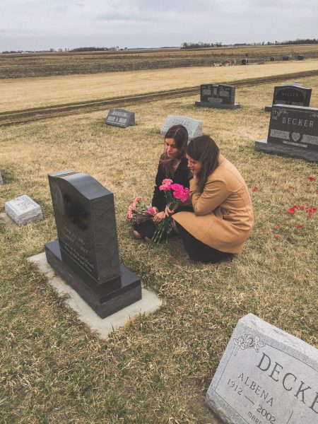 Kristen and her sister in a cemetery