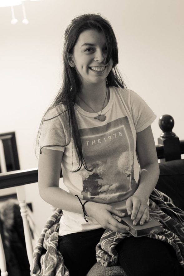 Lisey holding a journal.