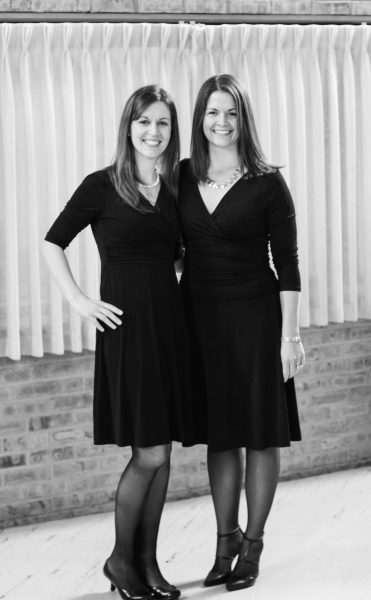 Kristen with her sister, both in black dresses.
