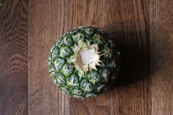 A pineapple missing its crown.