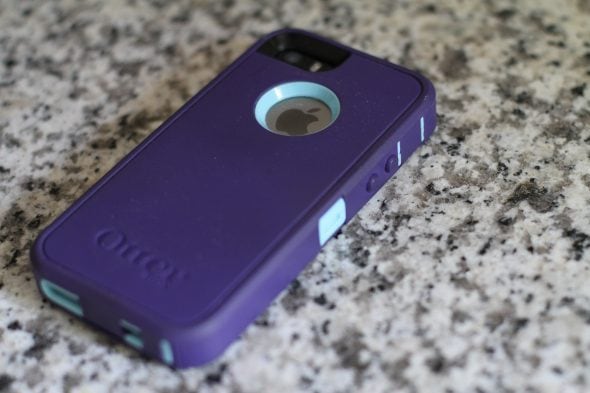 Iphone SE in a purple Otterbox case.