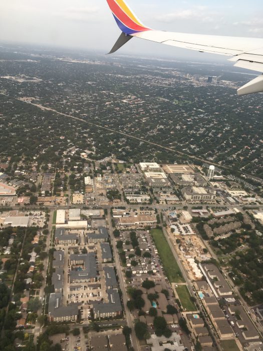 A view of a city from an airplane window.