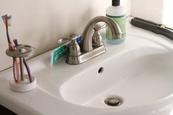 A tiny white bathroom sink.