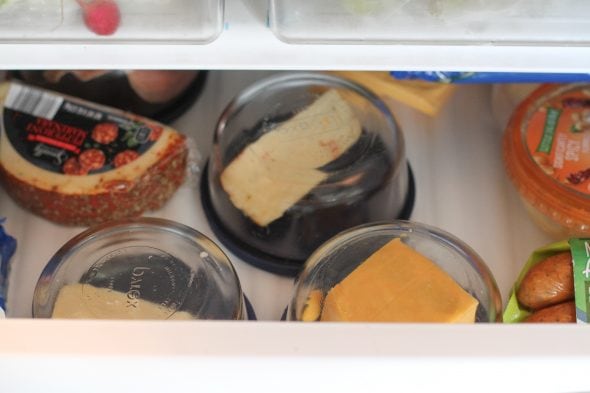 cheese containers in fridge drawer
