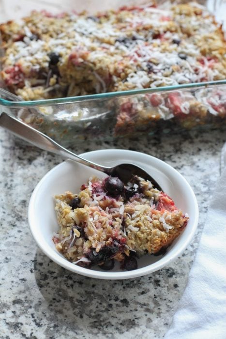 A bowl of baked oatmeal on a granit countertop.