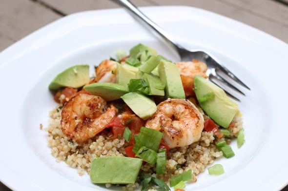 A bowl of shrimp, avocado, and lime quinoa.