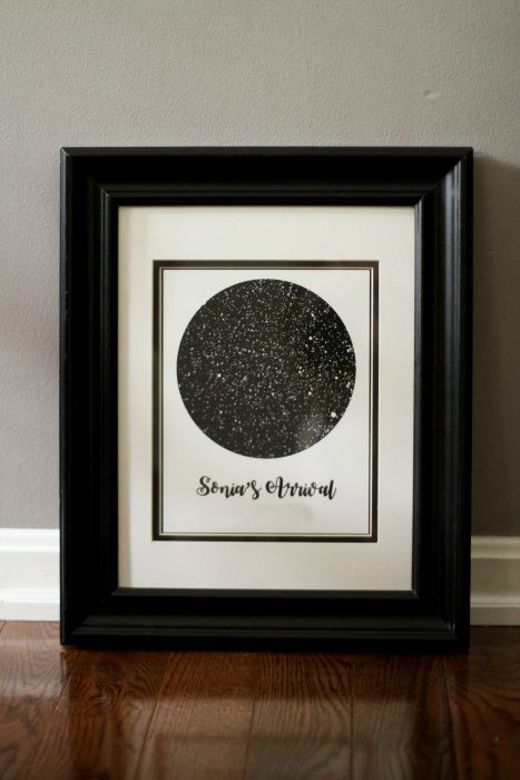 A black framed custom star map.