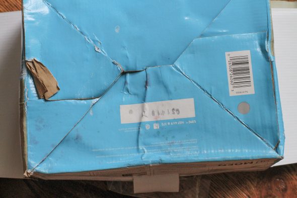 A damaged blue cardboard box.
