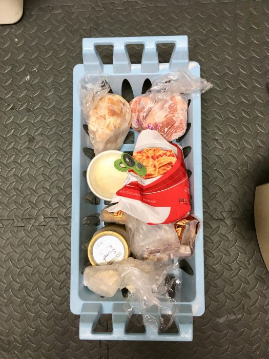 A full chest freezer basket.