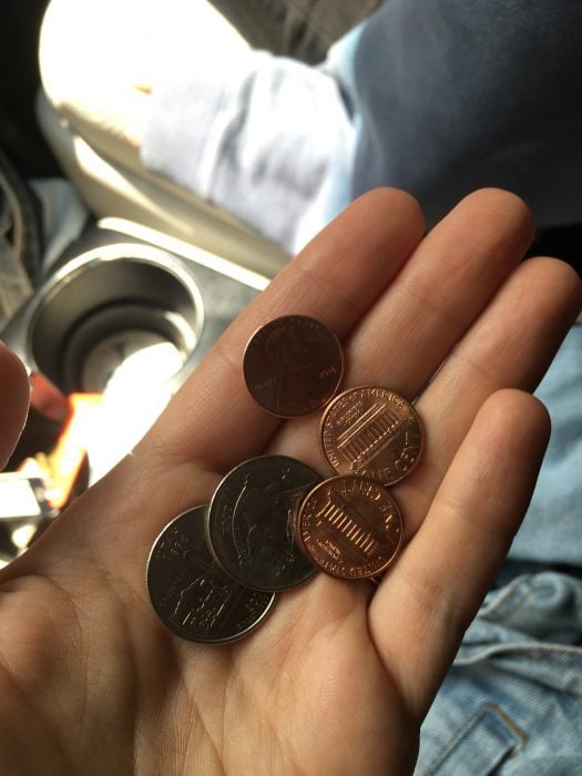 coins in an open hand.