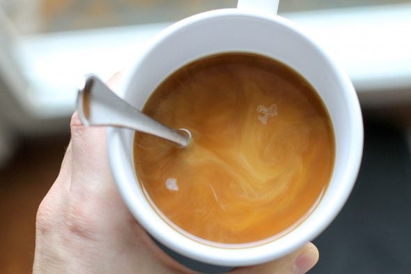 A cup of coffee in a white mug.