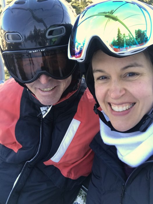 Kristen and her dad in ski gear.