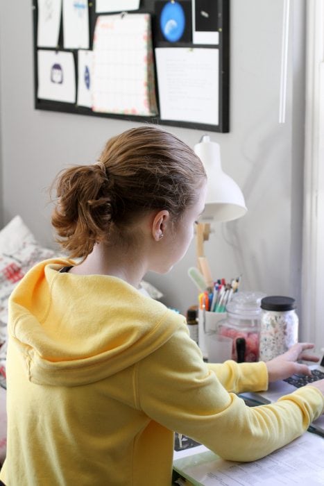 Sonia sitting at her desk