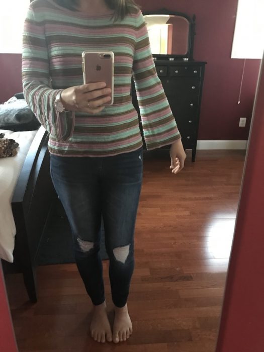 a pastel striped sweater