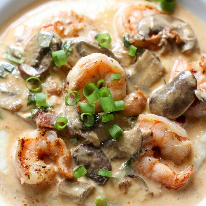shrimp and grits in a white bowl.
