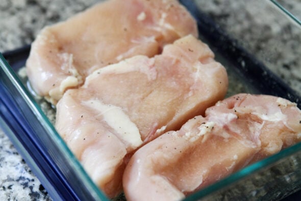 brinerating chicken in a Pyrex dish.