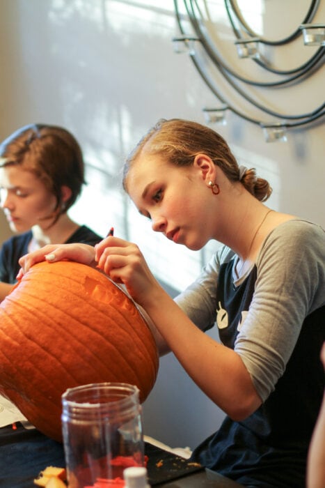 Sonia carving Halloween pumpkin