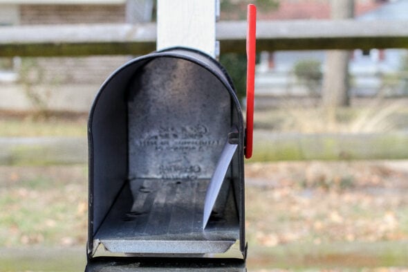 A medical bill in mailbox.