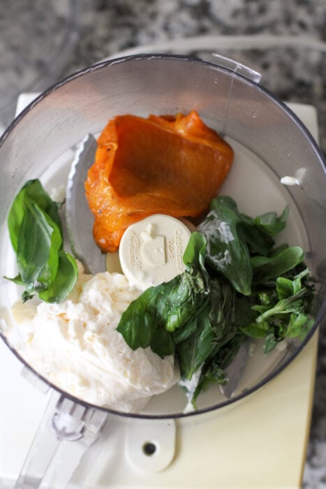 Roasted red pepper mayo ingredients in a food processor.