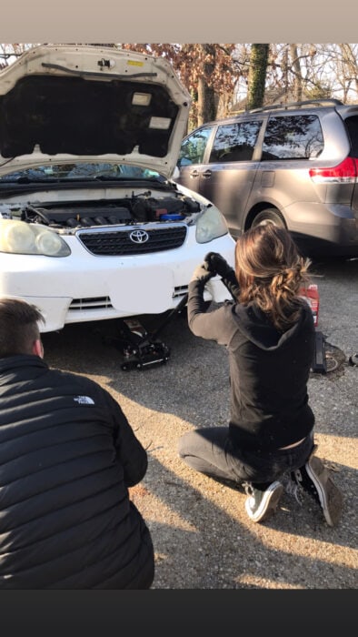 Lisey changing her oil