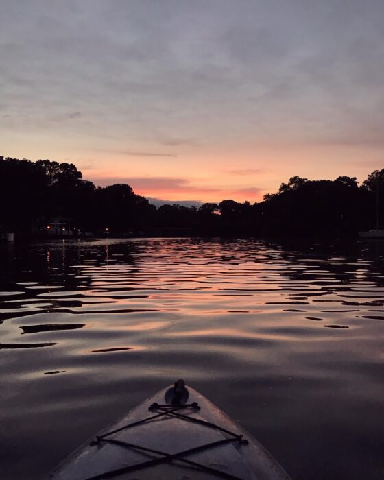sunset on the river from a kayak.