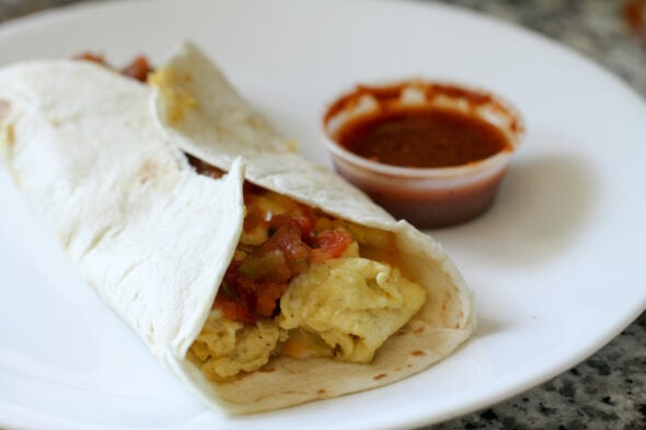 egg burrito with hot sauce.