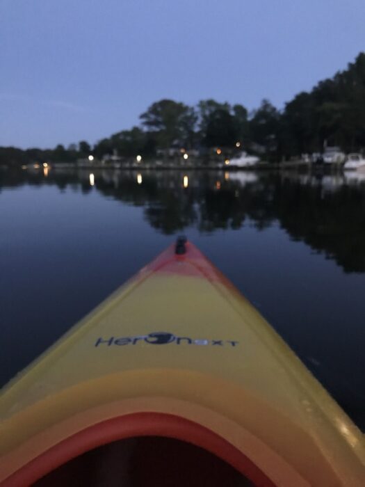 kayak on a river at night.