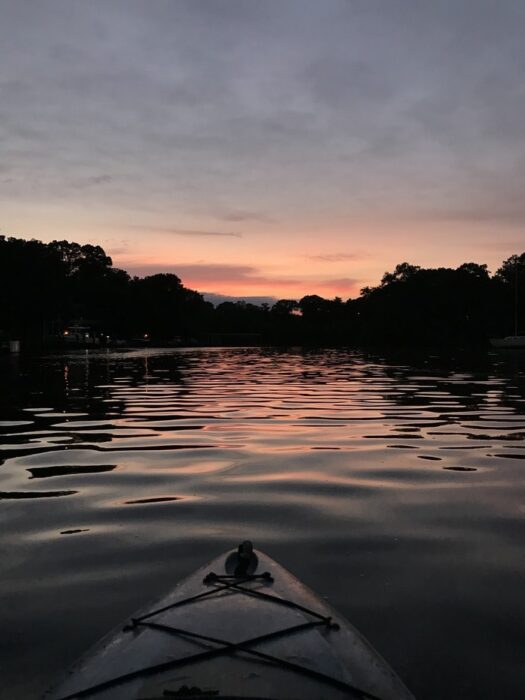 kayak on a river at night.