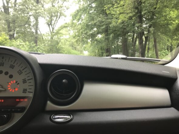 view of trees through the windshield.