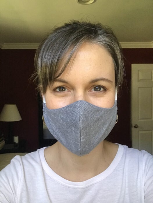 Kristen wearing a homemade gray fabric mask