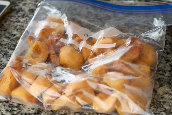 frozen peaches in a ziploc bag