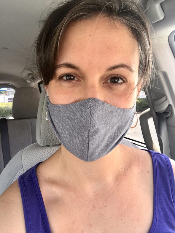 Kristen wearing a gray fabric face mask