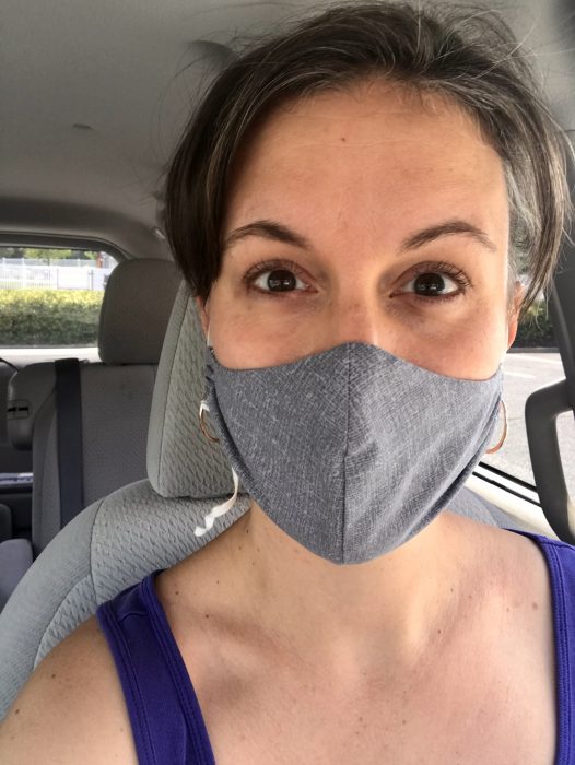 Kristen wearing a gray fabric face mask