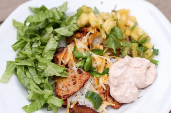 Burrito bowl in a white dish.