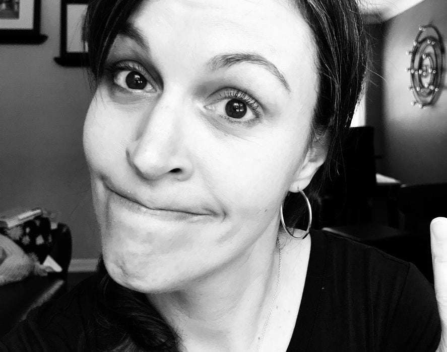 Kristen with a grim expression