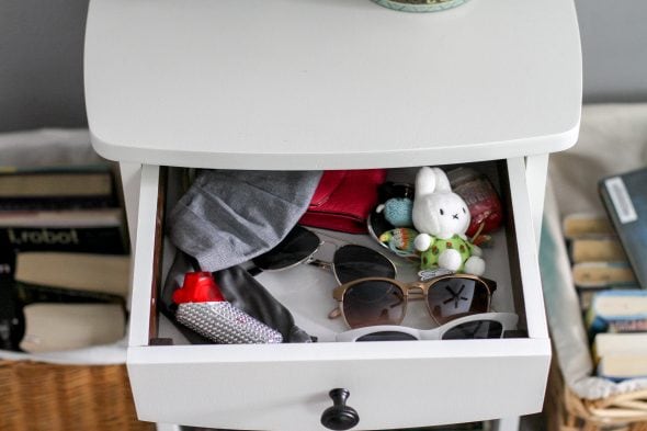 nightstand drawer with sunglasses inside