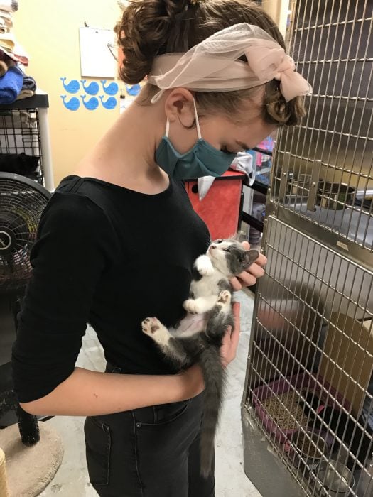 Sonia holding a rescue kitten