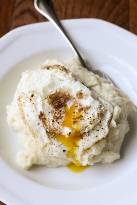mashed potatoes with fried eggs.