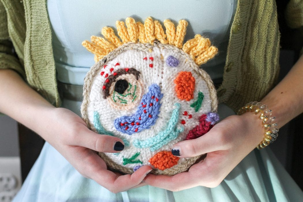 Sonia holding knitted cell