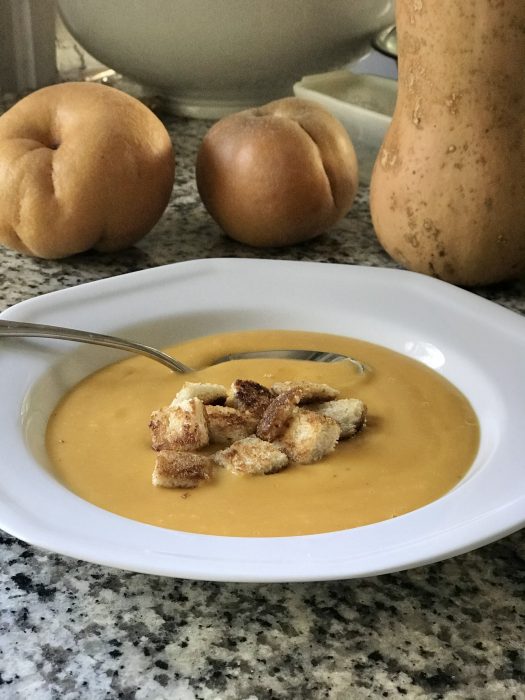 croutons on top of carrot soup