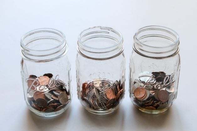 Three glass jars of coins.