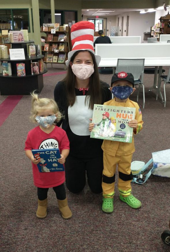 Ruth and two kids in Halloween costumes.