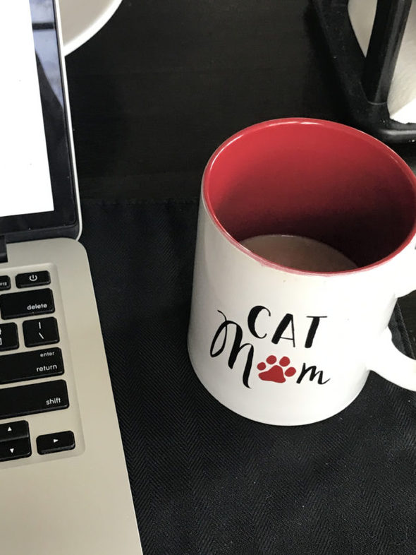 mug of tea in a Cat Mom mug.