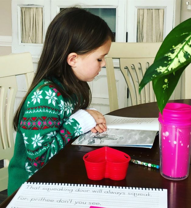 little girl doing schoolwork