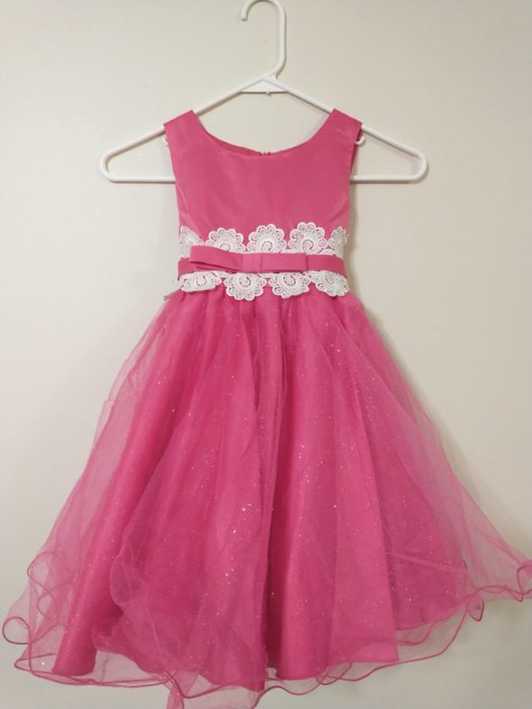 A pink fancy dress from a yard sale.