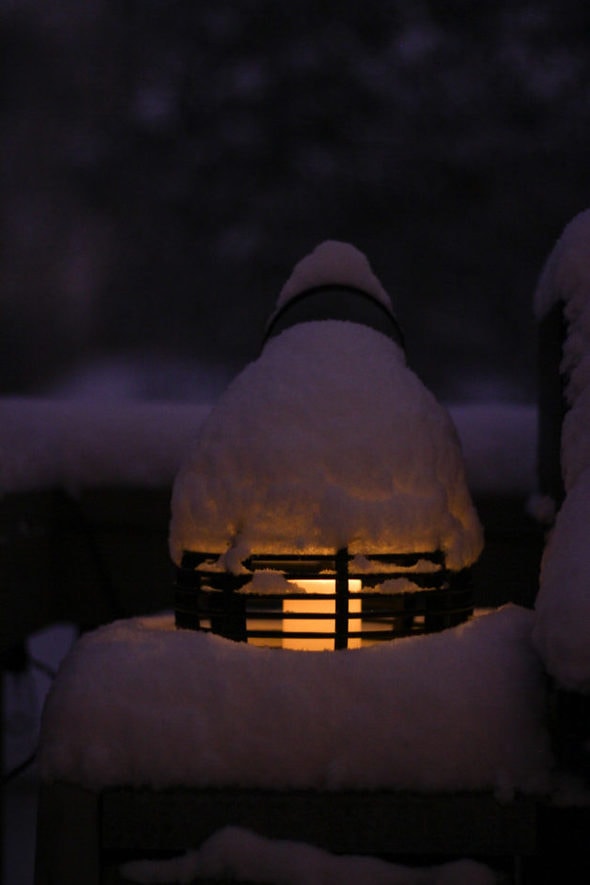 A lantern covered in snow.