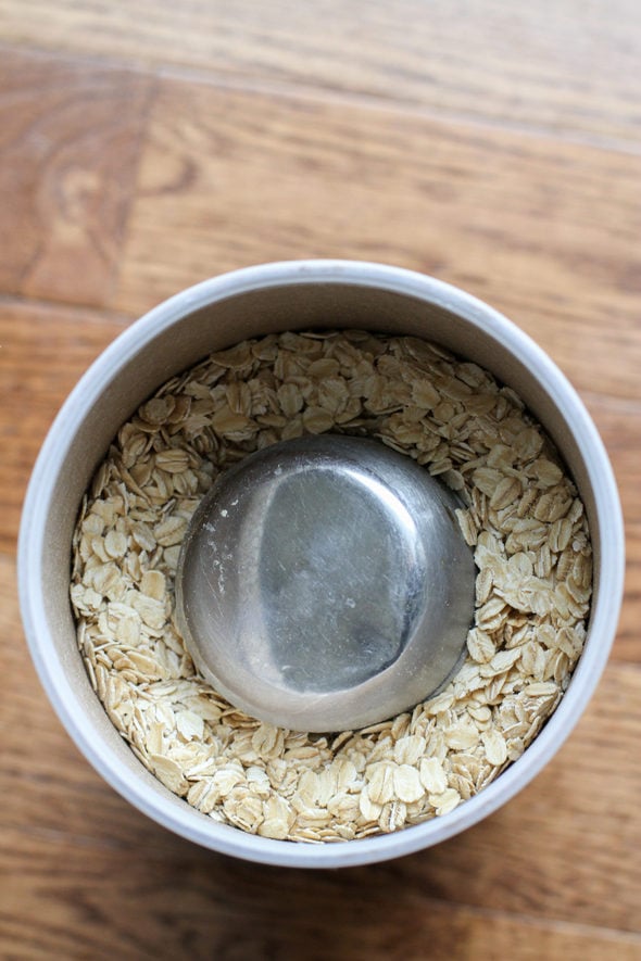 measuring cup in oatmeal.